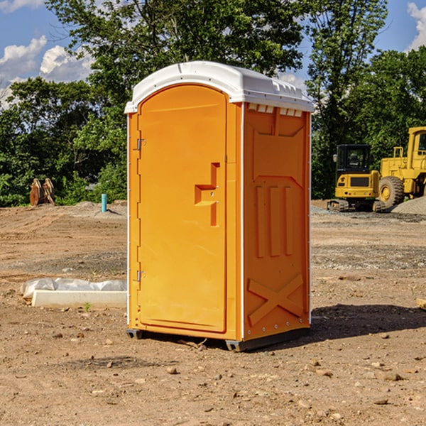 what is the cost difference between standard and deluxe portable restroom rentals in Bradford